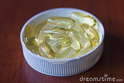 The pill of fish oil Stock Photo